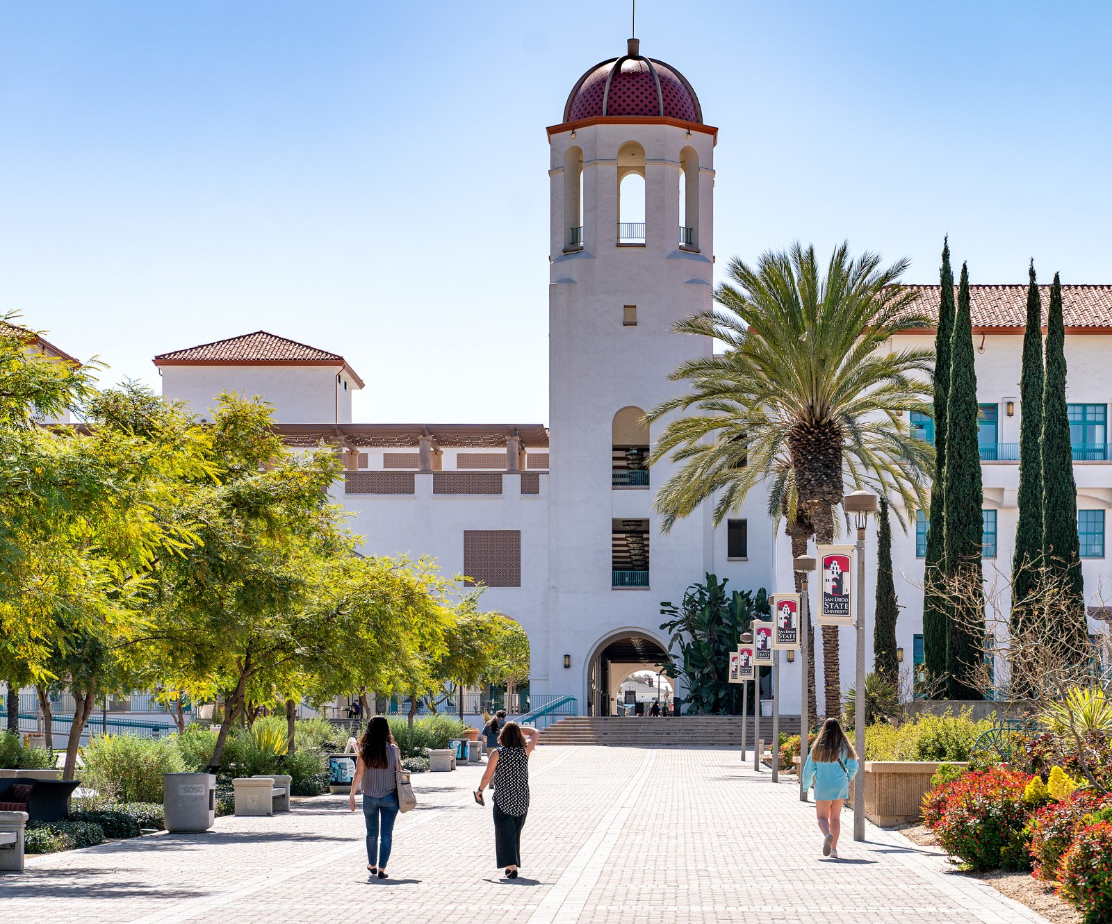 Students walk down Centennial Walkway